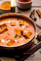 Paneer Butter Masala or Cheese Cottage Curry in serving a bowl or pan, served with or without roti and rice