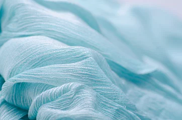Fotobehang Blauwe turquoise stof doek materiële textuur textiel macro achtergrond wazig © Kabardins photo
