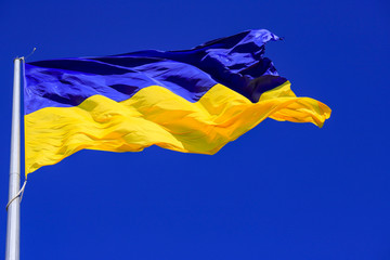 The largest yellow and  blue state flag of Ukraine on the flagpole 30 meters in the Ukrainian Dnepr city  (Dnipropetrovsk, Dnepropetrovsk, Dnipro)