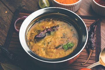 Dal Tadka Fry / Indian Lentil Curry served in a bowl with rice and roti, selective focus