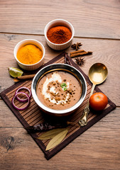 Dal makhani / makhni is a popular dish from India. Made with ingredients like whole black lentil, butter and cream. Served with Naan/roti and rice