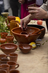 A man is preparing queimada (traditional Galician hot drink made with flamed 