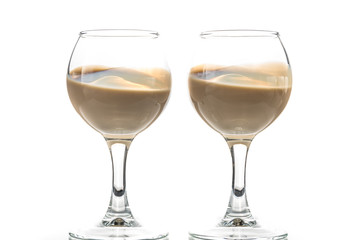 Pour chocolate thick liquor in two round glasses