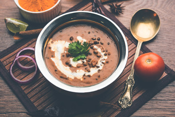 Dal makhani / makhni is a popular dish from India. Made with ingredients like whole black lentil, butter and cream. Served with Naan/roti and rice