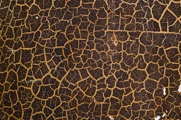 Ancient cracked wall texture. brown and yellow colored background