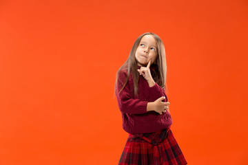 Fototapeta premium Remember all. Let me think. Doubt concept. Doubtful, thoughtful teen girl remembering something. Young emotional child. Human emotions, facial expression concept. Studio