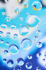 beautiful calm clean water drops on light blurred background