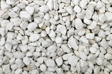 The texture of stones and cobblestones. White crushed stone