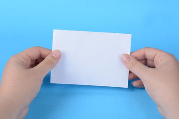Fototapeta premium Woman hands holding empty note paper