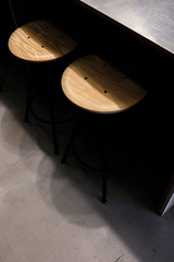 Industrial wooden stool on concrete floor