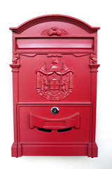 Red vintage post box on white background