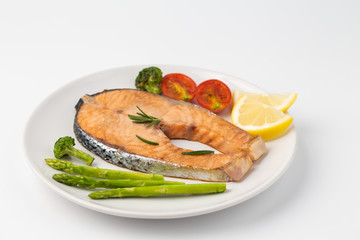 Salmon Grilled on a white plate isolated on white background.