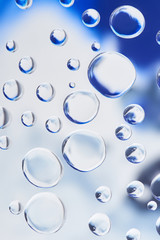 beautiful transparent water drops on blurred abstract background
