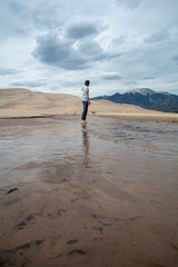 Playing in a desert mountain stream - 228150884
