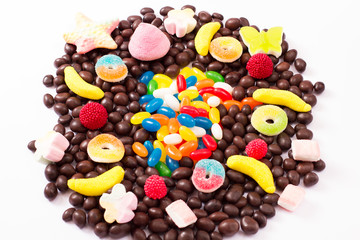 Colorful candy, lollipop and sweets isolated on white background. Top view. Selective focus.