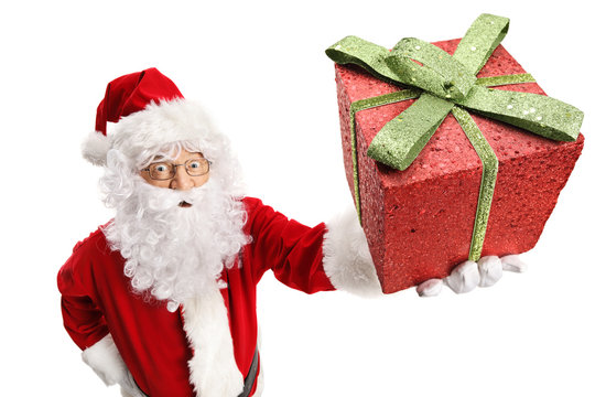 Santa Claus holding a gliterry present box