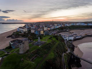 Aerial view of Tenby Beach and harbour at sunset, Pembrokeshire, Wales, UK