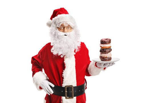 Santa Claus holding a plate of donuts