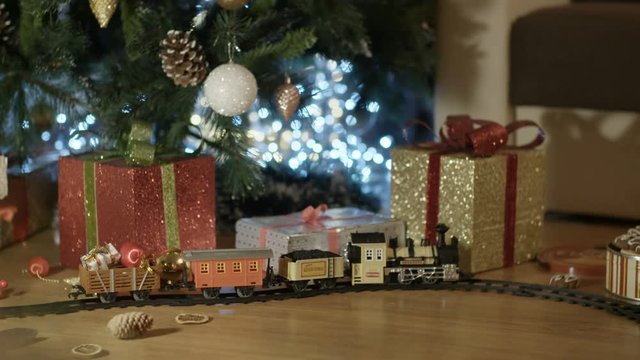 A beautiful toy steam train on the floor. Christmas &ndash; New Year Gift