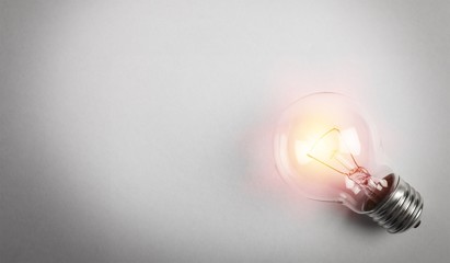 Glowing yellow light bulb, busienss idea concept