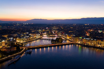 Fototapeta premium Aerial night view of Geneva city waterfront skyline in Switzerland