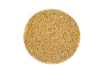 Dried fenugreek seeds isolated on white background