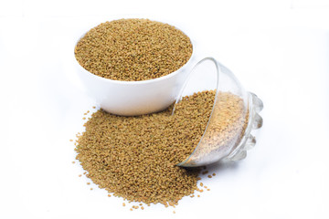 Dried fenugreek seeds isolated on white background