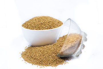 Dried fenugreek seeds isolated on white background