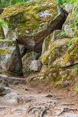 Stone cliff with sharp protrusions in Monrepos park in city Vyborg, Russia. August 2018.