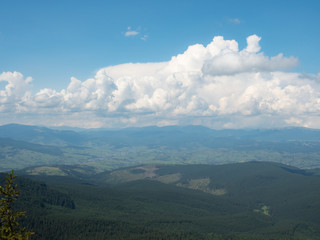 Landscape of mountains and cloudy sky. Carpathians mountains, west Ukraine. Big white cumulus...
