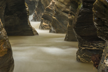 Nature canyons with waterfall surrounded by rocks