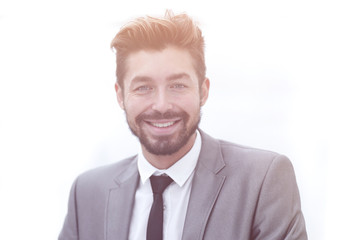 Portrait of a young businessman at the railing in the office