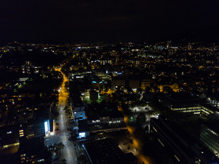 Fototapeta na wymiar Aerial view of european city in night with bright lights and streets with cars