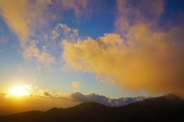 beautiful sunset with clouds over the mountains