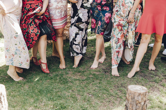 Row of female guests of a wedding showing her legs