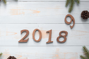 2018 - 2019 number with Christmas decorations on wooden background, Business Goals, Mission, Resolution, New Year New You concept