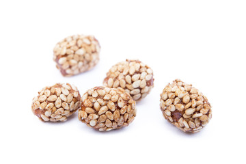 Coated peanuts with sesame isolated on white background