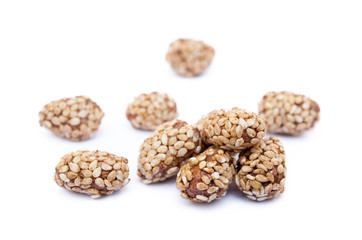 Coated peanuts with sesame isolated on white background