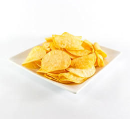 Potato chips on white dish and white background