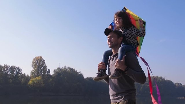 Family with a kite. Father with a child and a kite.