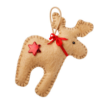 Soft toy of textile in shape of deer. Christmas decoration isolated on white background, closeup
