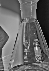 Drops of the solution are collected in a glass flask