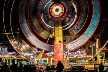 Illuminated carousel at night. Bytom - obrazy, fototapety, plakaty