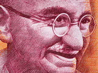 Mahatma Gandhi face portrait on India 200 rupee (2017) banknote close up macro, leader of the...
