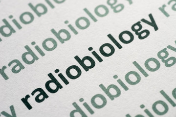 Fototapeta premium word radiobiology printed on paper macro