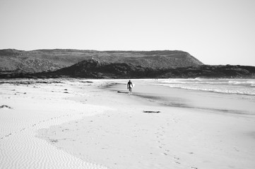 Beach, footsteps, surfer walking away, Atlantic Ocean, South Africa, Cape Town, black and white