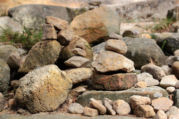 Pyramids and men of stones in the rocky mountains in the reserve Hrensko, Czech Republic. Trolls and chedo. Signs climbers. Buddhism.