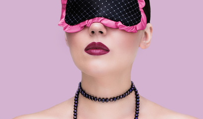 Portrait close up of a pretty young woman with bright painted lips