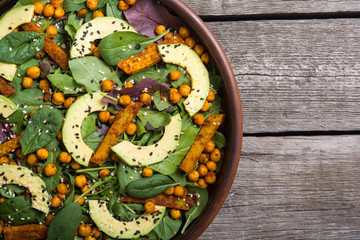 Baby spinach salad with sweet potato , chickpeas and avocado