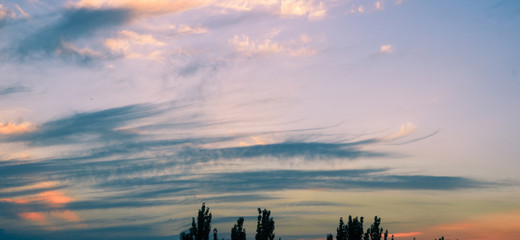 Fototapeta premium Landscape with dramatic light - beautiful golden sunset with saturated sky and clouds.